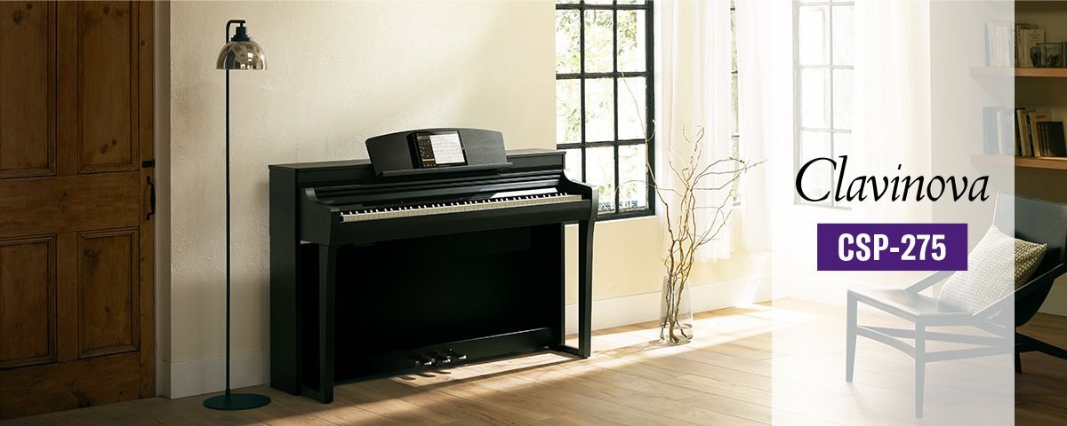 Lifestyle image of polished ebony Yamaha Clavinova CSP-275 Digital Piano angle view