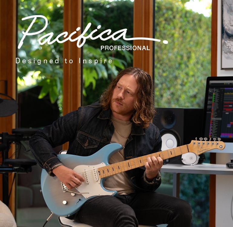 Pacifica professional logo & designed to inspire text. Male in home studio playing Beach Blue Burst.