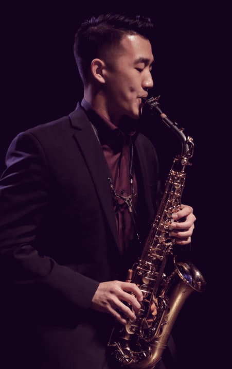 man in a formal attire performing with Allegro by Yamaha