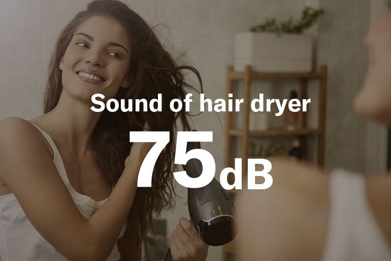 image showing when a woman is using a hair dryer the sound level produces 75 decible