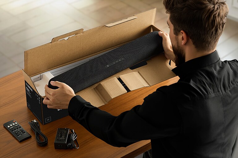 Person taking a B200A out of its packaging