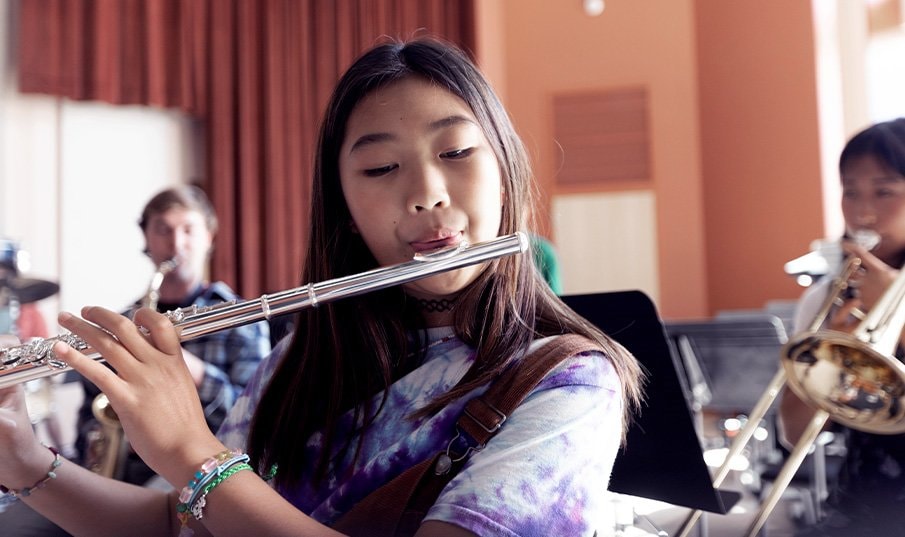 image of a young girl playing yamaha flute