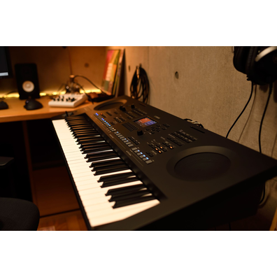 A home music workspace with a computer and keyboard