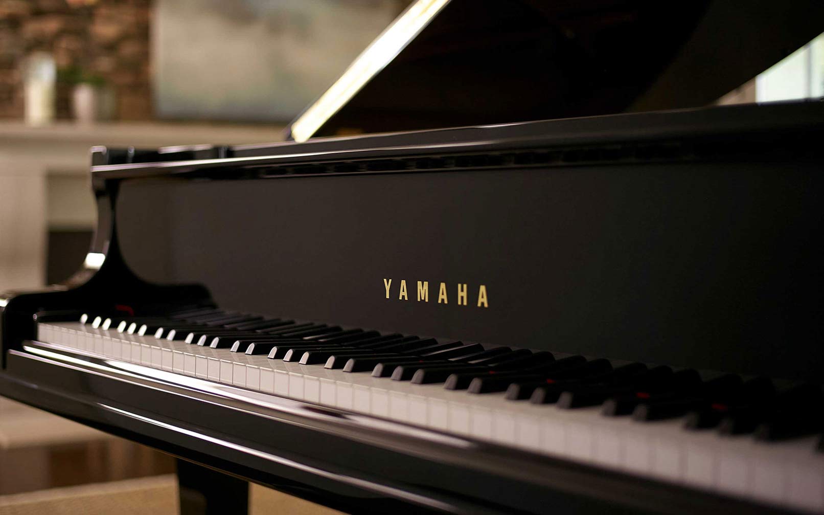  Yamaha piano with open lid showcasing its state of the art keys and frame