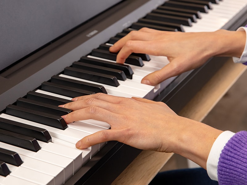 The hands of a person playing the P-143