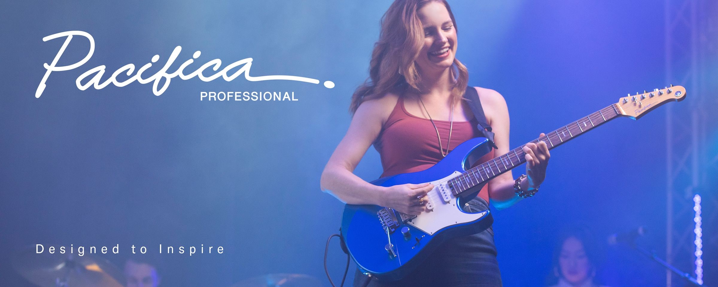 Pacifica professional logo & designed to inspire text. Female on stage performing with Sparkle Blue.