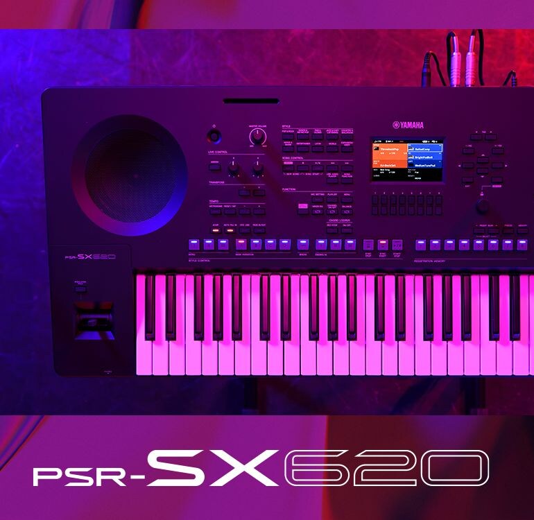 Top view of a PSR-SX620 keyboard under stage lighting.