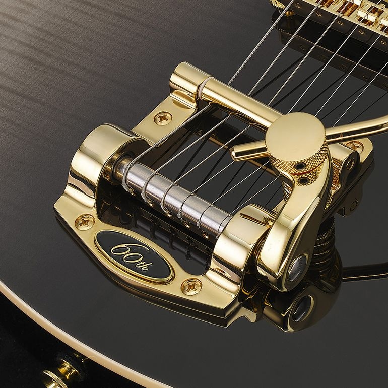 A luxurious flame maple top in Noble Black finish, with a tremolo unit adorned by a special 60th Anniversary logo.
