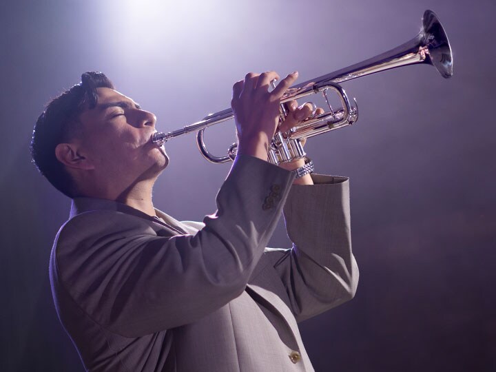 a man is playing yamaha trumpet