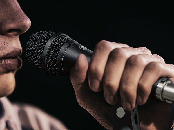 Person singing into the Yamaha YDM microphone.