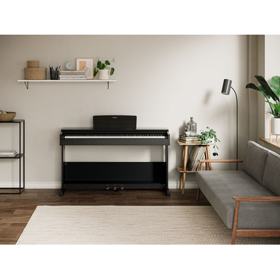 ARIUS YDP-105 88-Key Black Digital Piano in a room