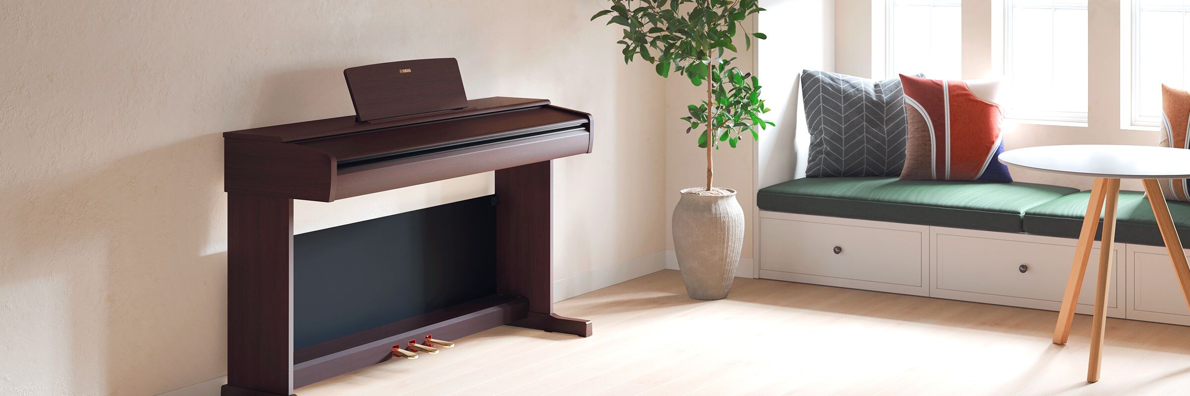 An ARIUS piano in a living room with the lid closed, blending in with the interior