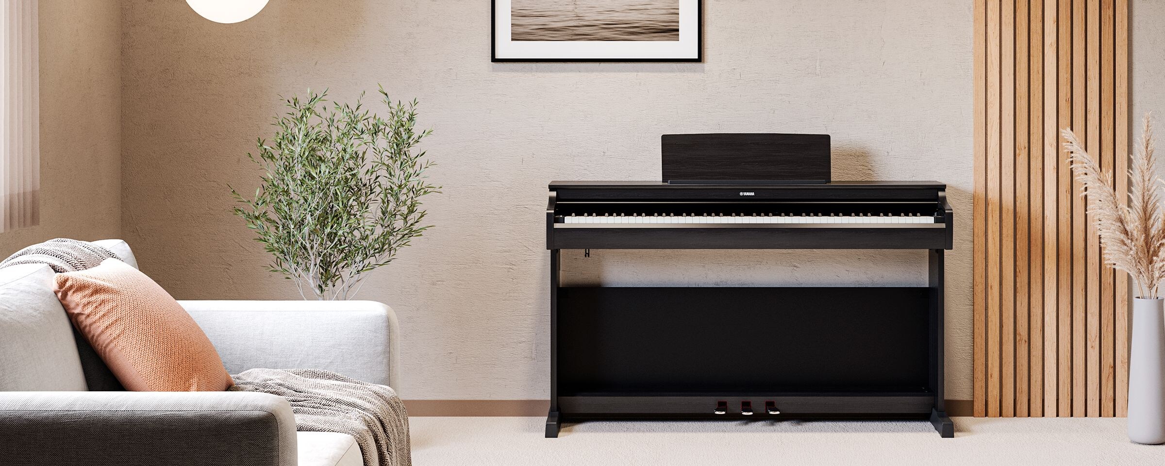 A living room featuring a black ARIUS piano with houseplants and a sofa, harmoniously integrated with the interior