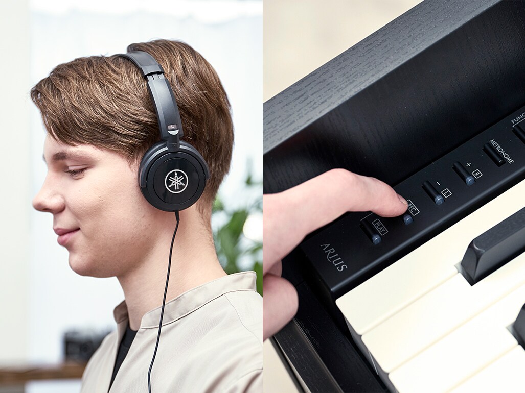 Playing an ARIUS piano with headphones and operating the control panel buttons