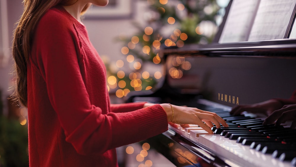 Woman playing Yamaha Piano