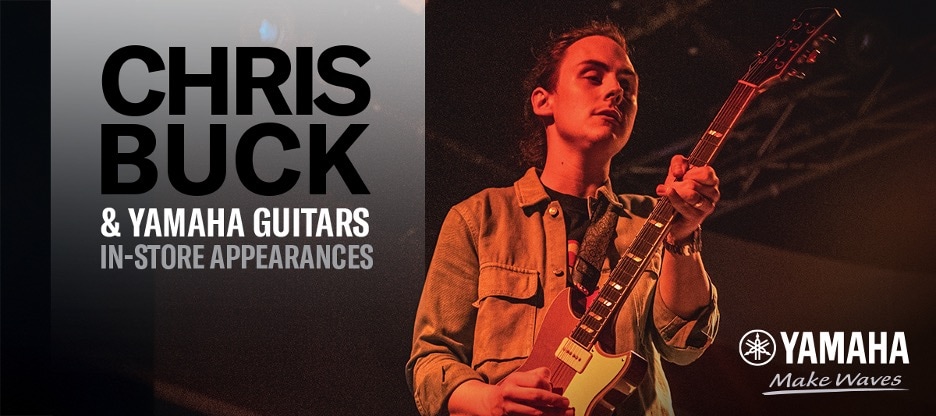Chris Buck playing a Yamaha Electric guitar in a stage