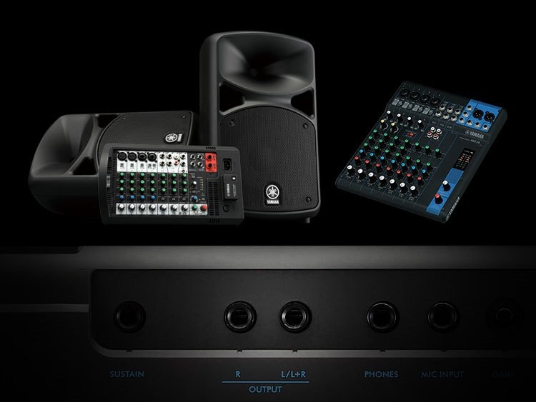 Close-up of L/R output with speakers and mixers