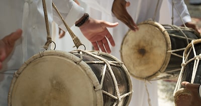 Group of man playing different drums