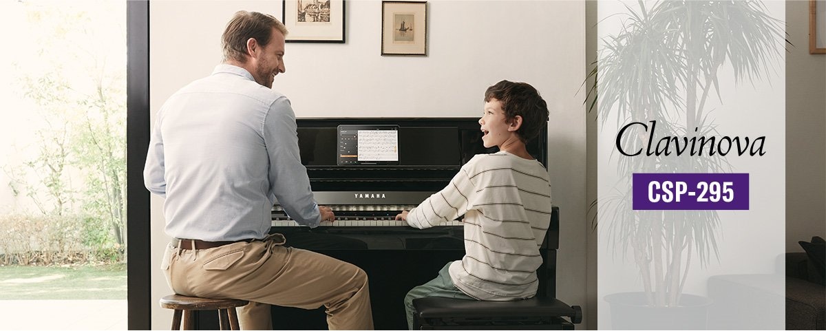 Man teaching kid on CSP-295 piano front view