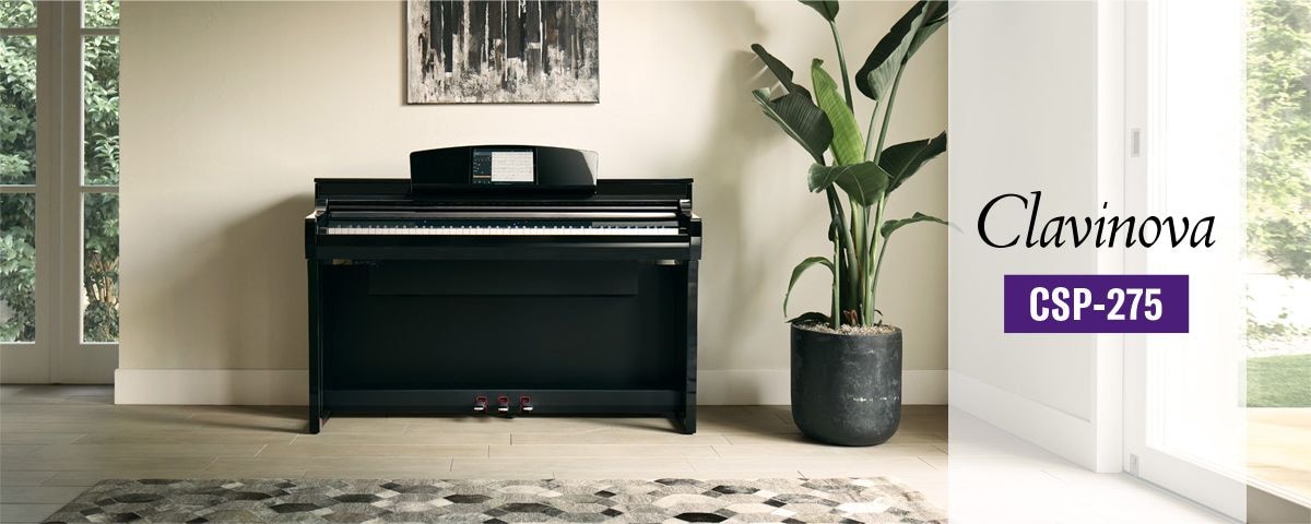 Lifestyle image of polished ebony Yamaha Clavinova CSP-275 Digital Piano front view