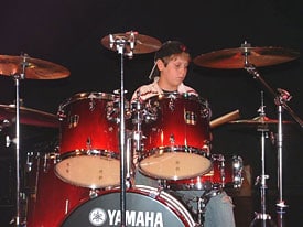 Young man playing drum kit