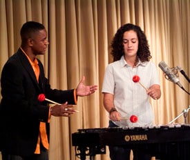 Stefon Harris instructing young woman on the Vibraphone