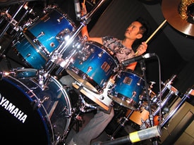Akira Jimbo playing the drums