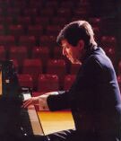 Jacques Rouvier playing the piano