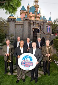 Disney and Yamaha Executives pose in front of Magic Kingdom