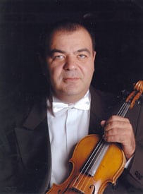 Togrul Ganiyev poses with his violin