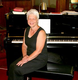 Organist at Brackett Church Seated at Yamaha Piano