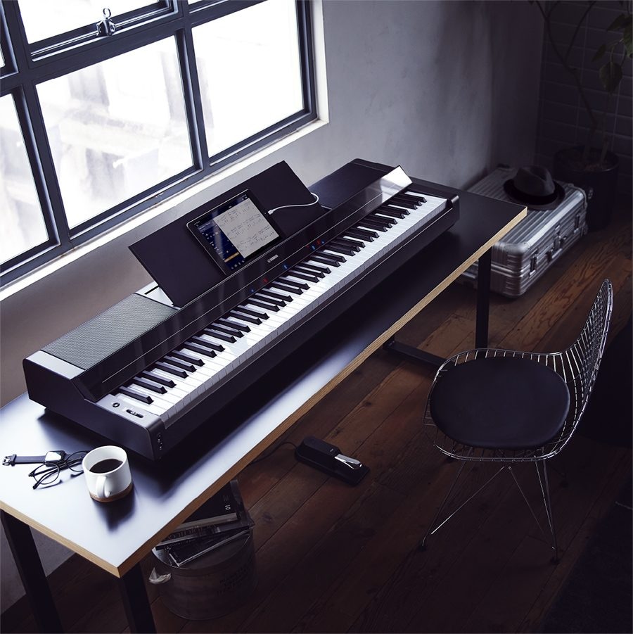 A Yamaha P-S500 Portable Digital Smart Piano on a desk