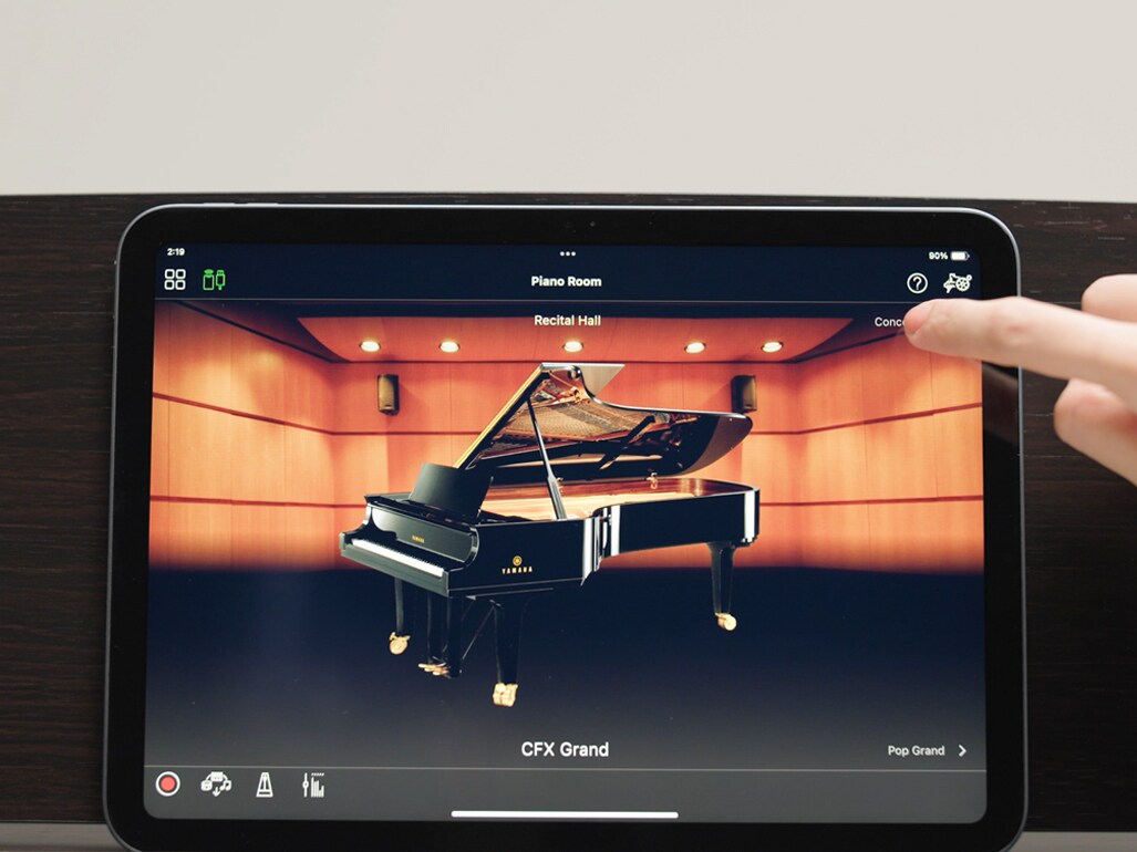A tablet screen showing the Smart Pianist app in use