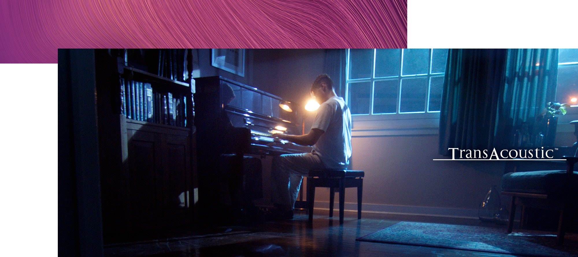 Lifestyle image of a man playing Transacoustic piano - Desktop