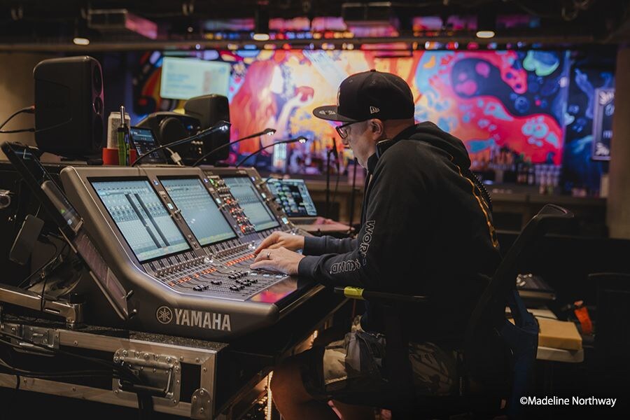 FOH monitor engineer Zach “Bear” Bair working with the Yamaha Rivage PM5 console during the concert.
