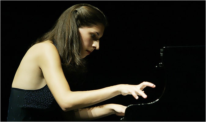 Close-up of Christina Sia Thayer playing Piano